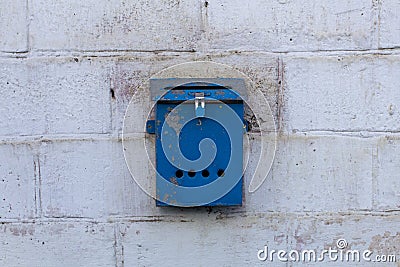 Mailbox blue in retro style on brick wall. old iron Stock Photo