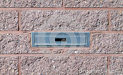 Mailbox built-in into pink brick wall Stock Photo