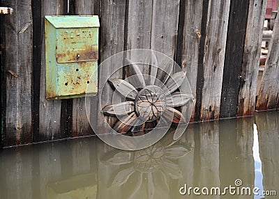 Mailbox during the flood. The river Ob, which emerged from the shores, flooded the outskirts of the city. Editorial Stock Photo