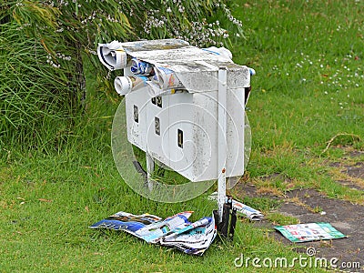 mailbox with junk mail sticking out Editorial Stock Photo