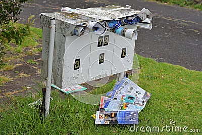 mailbox with junk mail sticking out Editorial Stock Photo