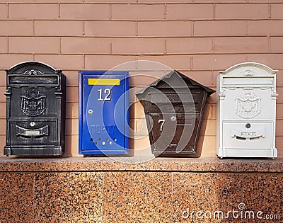 Mailboxes on the wall of a brick house Stock Photo