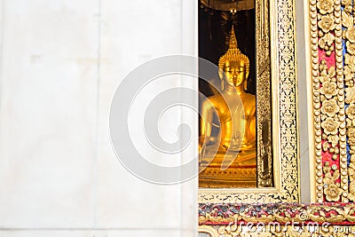 The main Buddha statue looking through the window of Wat Bowonniwet Vihara temple, Bangkok, Thailand Stock Photo