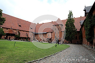 The main courtyard of Malbork Castle, which was built by the Teutonic Knights in the town of Malbork, Poland Editorial Stock Photo