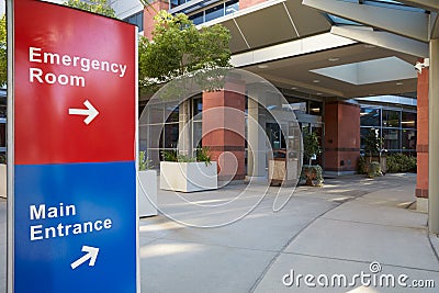 Main Entrance Of Modern Hospital Building With Signs Stock Photo