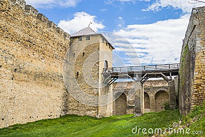 The main entrance of old castle Hotel near the river. Khotyn Fortress - medieval castle on yellow autumn hills. Ukraine, Eastern Editorial Stock Photo