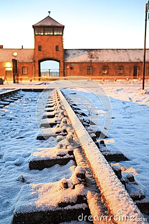 Main gate to nazi concentration camp of Auschwitz Birkenau. Editorial Stock Photo