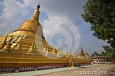 Main giant stupa of Shwemawdaw Pagoda at Bago, Myanmar with trees Stock Photo