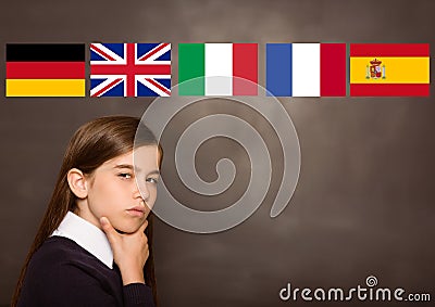 main language flags over girl, blackboard background Stock Photo