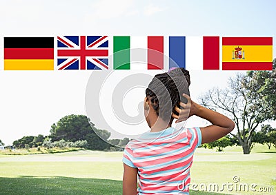 main language flags over girl in the park Stock Photo