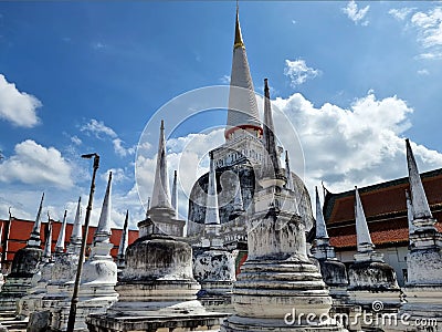 The main larger stupa with group small stupas in the Sri Lankan-style at Wat Phra Mahathat Woramahawihan Stock Photo