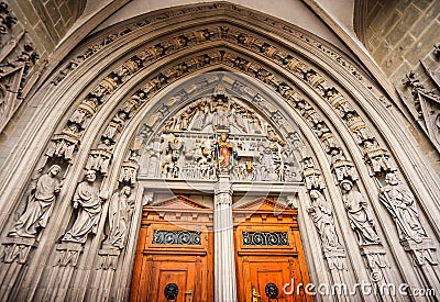 The main portal at the main gate of Saint Nicholas of Myre Parish Church of Freiburg, constructed around 1380 Stock Photo