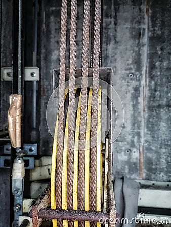 Main rusted suspension rope with sheave Stock Photo