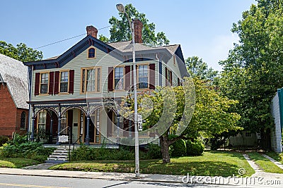 Main street of an old American city with traditional buildings. Wooden houses with carved steps Editorial Stock Photo