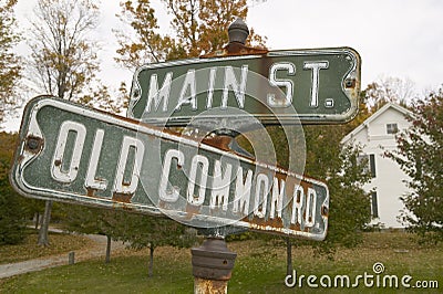 Main Street USA and Old Common Road sign in autumn, western Massachusetts, New England Stock Photo