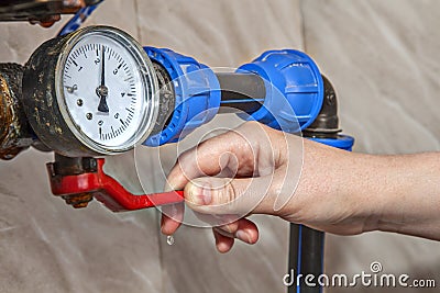 Main Water Shutoff Valve, Hand Shutting Off lever controls suppl Stock Photo