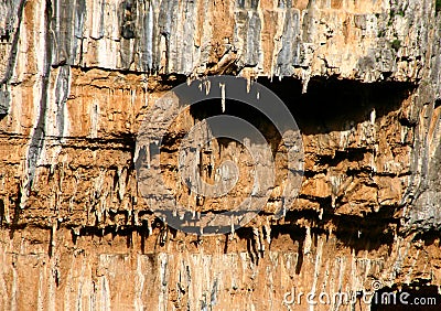 Mainalo mountain in Greece.Rock layers, various formations of rocks with stalactites. Natural background with fascinating texture Stock Photo