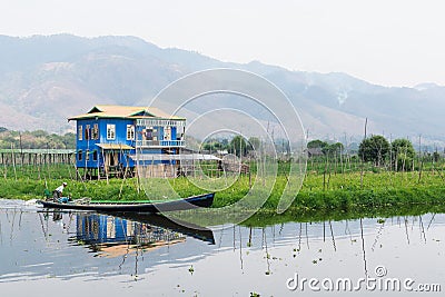 Maing Thauk, Myanmar - April 2019: traditional Burmese floating house on water in Inle lake Editorial Stock Photo