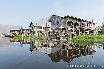 Maing Thauk, Myanmar - April 2019: traditional Burmese floating house on water in Inle lake Editorial Stock Photo