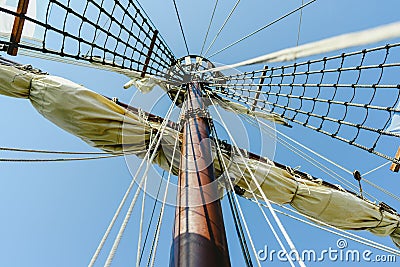 Mainmast and rope ladders to hold the sails of a sailboat Stock Photo