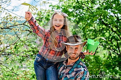 Maintain garden. Planting flowers. Family dad and daughter planting plants. Plant your favorite veggies. Planting season Stock Photo