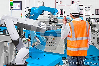 Maintenance engineer control automatic robotic hand machine tool Stock Photo