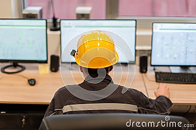 Maintenance engineer inspect relay protection system from control computer center Stock Photo