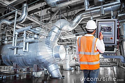 Maintenance engineer looking at monitor control in thermal power Stock Photo