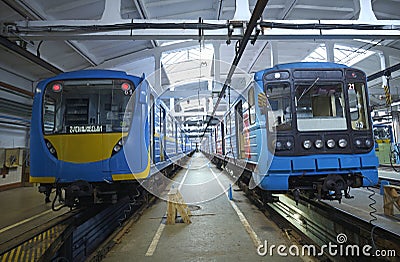 The maintenance hall: subway trains parked on pits for technical inspection Editorial Stock Photo