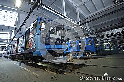 The maintenance hall: subway trains parked on pits for technical inspection Editorial Stock Photo