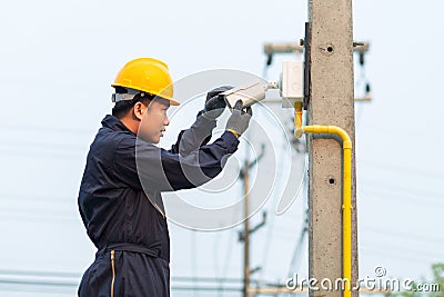 Maintenance technician checking CCTV camera Stock Photo