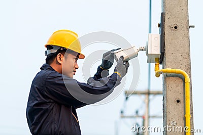 Maintenance technician checking CCTV camera, After-sales service concept Stock Photo