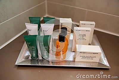 MAINZ, GERMANY - JUL 7th, 2017: Shower amenity set at a luxury hotel, A bar of soap, shampoo and body lotion Editorial Stock Photo