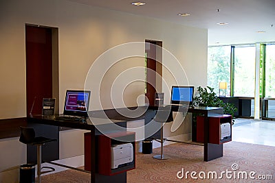 MAINZ, GERMANY - JUN 25th, 2017: Business Center with Computer Internet Printer Service, two PC in a luxury Hilton Hotel Editorial Stock Photo