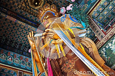 Maitreya Buddha statue in the Hall of Boundless Happiness, Lama Temple, Beijing Editorial Stock Photo