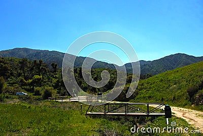 a majestic aerial shot of the lush green hillsides and mountains with a long winding road Stock Photo