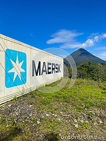 The majestic Arenal volcano and Maersk container Editorial Stock Photo