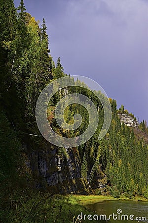 The majestic cliffs of Usva Pillars rise on the right bank of the Usva River in the Perm Territory Stock Photo