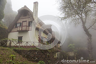 Majestic house in a foggy forest Stock Photo