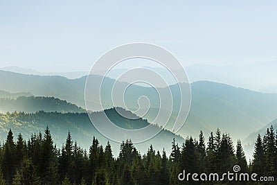 Majestic landscape of summer mountains. A view of the misty slopes of the mountains in the distance. Stock Photo