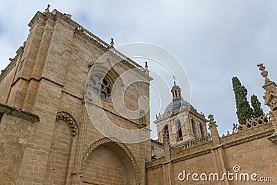 Majestic lateralview at the iconic spanish Romanesque architecture building at the Cuidad Rodrigo cathedral, tower and dome, Stock Photo