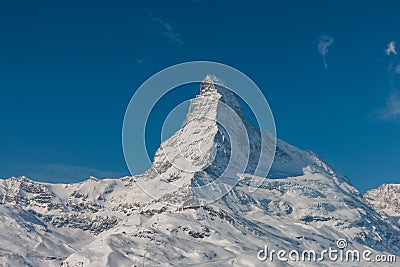 Majestic Matterhorn mountain in front of a blue sky Stock Photo