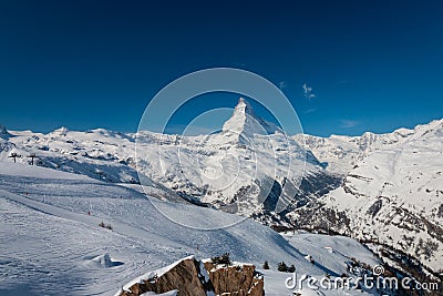 Majestic Matterhorn mountain in front of a blue sky Stock Photo