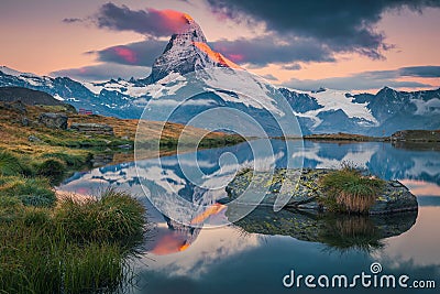 Majestic Matterhorn and Stellisee lake at dawn, Zermatt, Switzerland Stock Photo