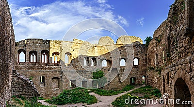 Majestic medieval castle ruins on the top of the hill Stock Photo