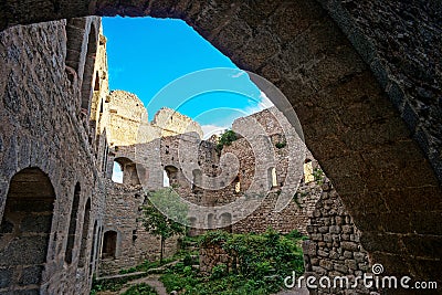 Majestic medieval castle ruins on the top of the hill Stock Photo