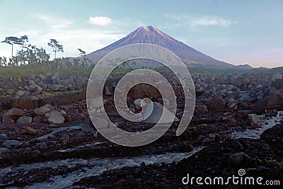 The majestic Mount Semeru with rocky cold lava river. Stock Photo