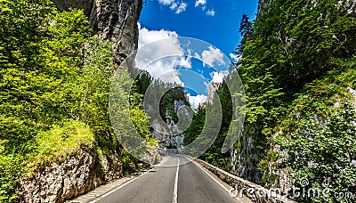 Majestic mountain scenery. road in mountains, autumn forest a gloving in sunlight. Romania- Carpathian Mountains. Bicaz Canyon Stock Photo