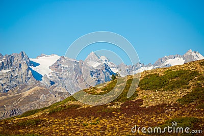 The majestic peaks of the Massif des Ecrins 4101 m national park with the glaciers, in France. Telephoto view from distant at hi Stock Photo