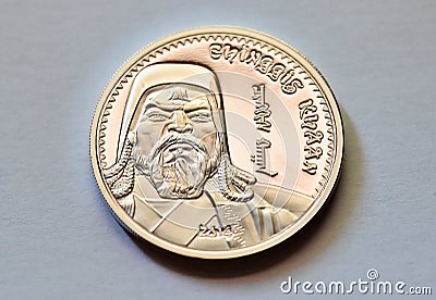 The portrait of genghis khan on a mongolian silver coin Stock Photo